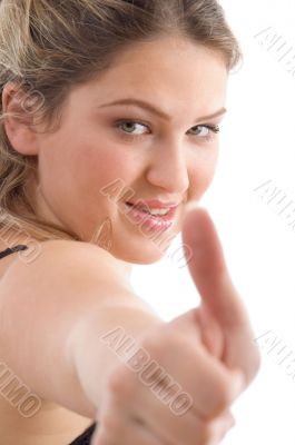 young pretty female showing thumbs up