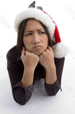 christmas hat wearing female in sad mood