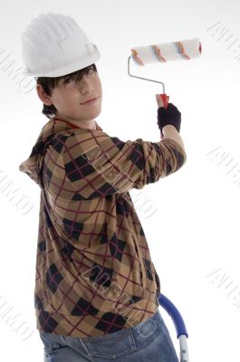 smiling young architect with paint brush