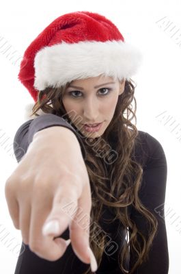 woman wearing christmas hat pointing you