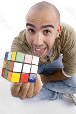 young guy showing his puzzle cube