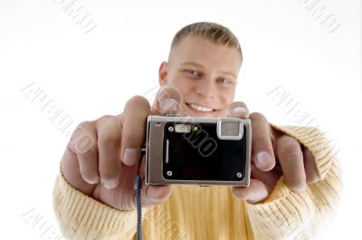 portrait of man showing camera