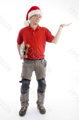 christmas hat wearing male looking at palm