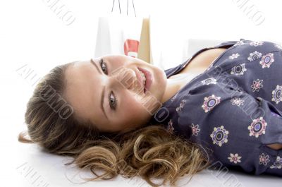 laying female with bags