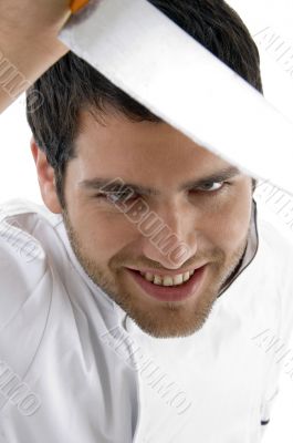 close up of male chef holding knife