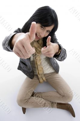 sitting woman showing approval sign