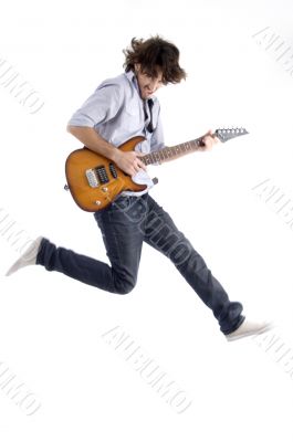jumping young male with guitar