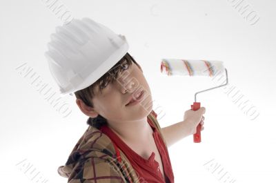 smiling young architect posing with paint brush