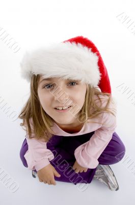 sweet girl with christmas hat looking you