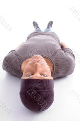 man lying on his back and looking at camera