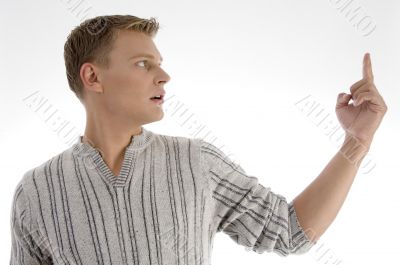 male looking at his index finger