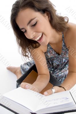 smiling young student reading book