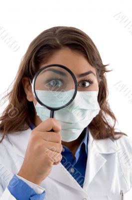 female doctor inspecting with magnifying glass