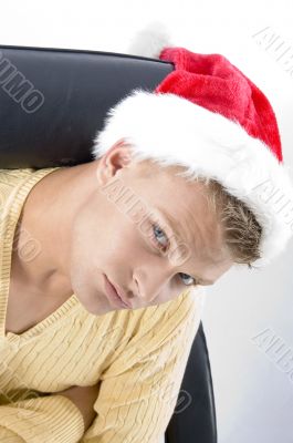 close up of male in christmas hat