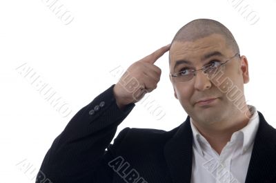 thinking businessman looking upward