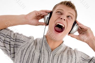 shouting man with headphone looking upward
