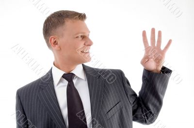 smiling businessman counting fingers