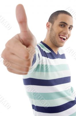 young boy showing thumbs up