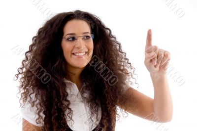 Hispanic female pointing upwards