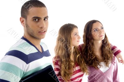 two girls holding each other and guy looking