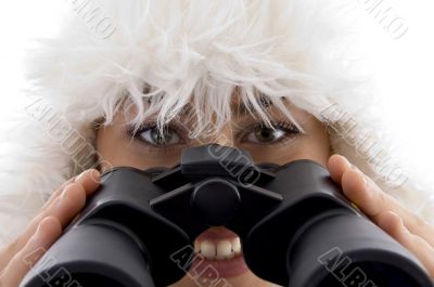 close up view of woman holding binocular