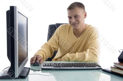 smiling man working on computer