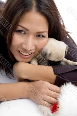 smiling female with christmas hat and puppy