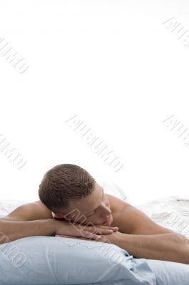 weary man sleeping in bed