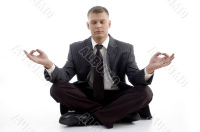 handsome young executive practicing yoga
