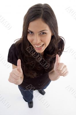 standing young woman showing thumb up