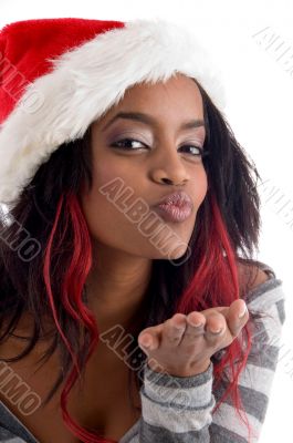 female in saint hat blowing kiss