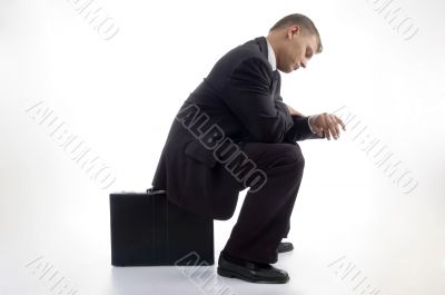 young accountant having a look at his watch