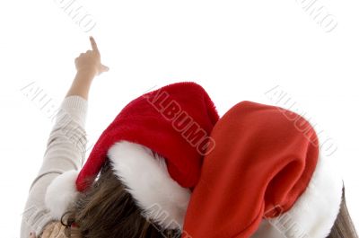 female heads wearing christmas hats