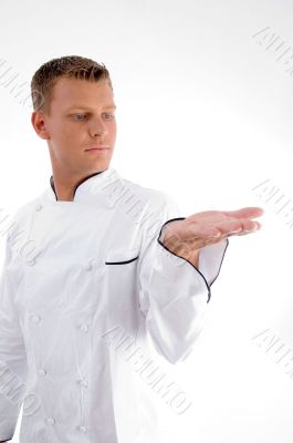 standing chef looking his palm