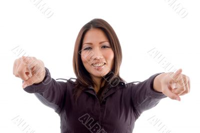 young woman pointing with both hands