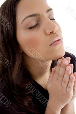 portrait of praying young woman
