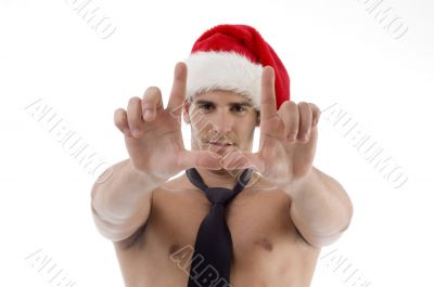 male wearing christmas hat and making