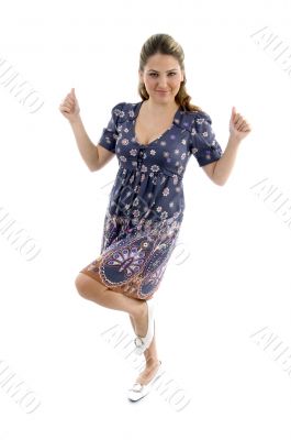 standing girl showing thumb up with both hands