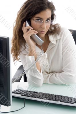 woman talking on phone and looking at camera