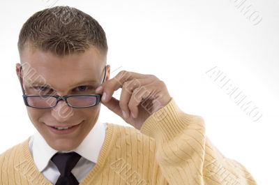 young student adjusting his spectacles