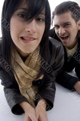 playful couple lying on floor