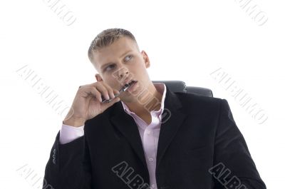 thinking young businessman looking upside