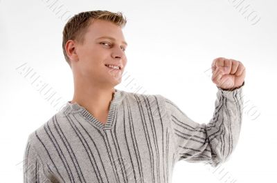 smiling man showing his fist