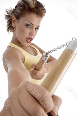 female with nunchaku