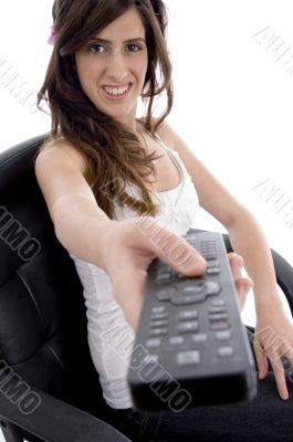 smiling woman with remote control