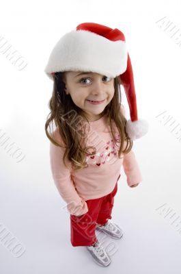 standing little girl with christmas hat