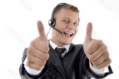young businessman showing thumbs up