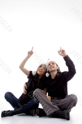 young couple wearing christmas hat