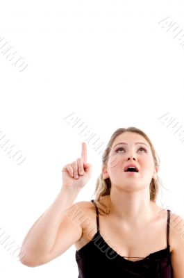 pretty woman pointing upwards