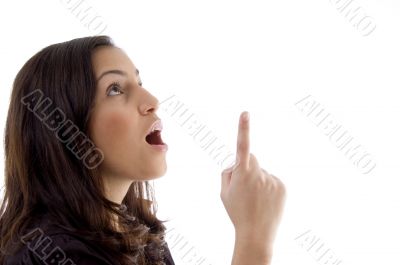 young woman pointing up